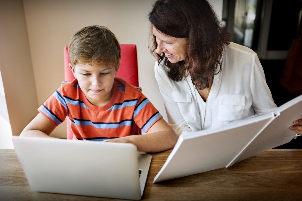 Mom and child using laptop