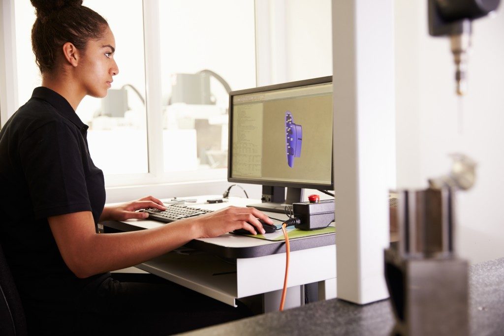 female engineer using computer