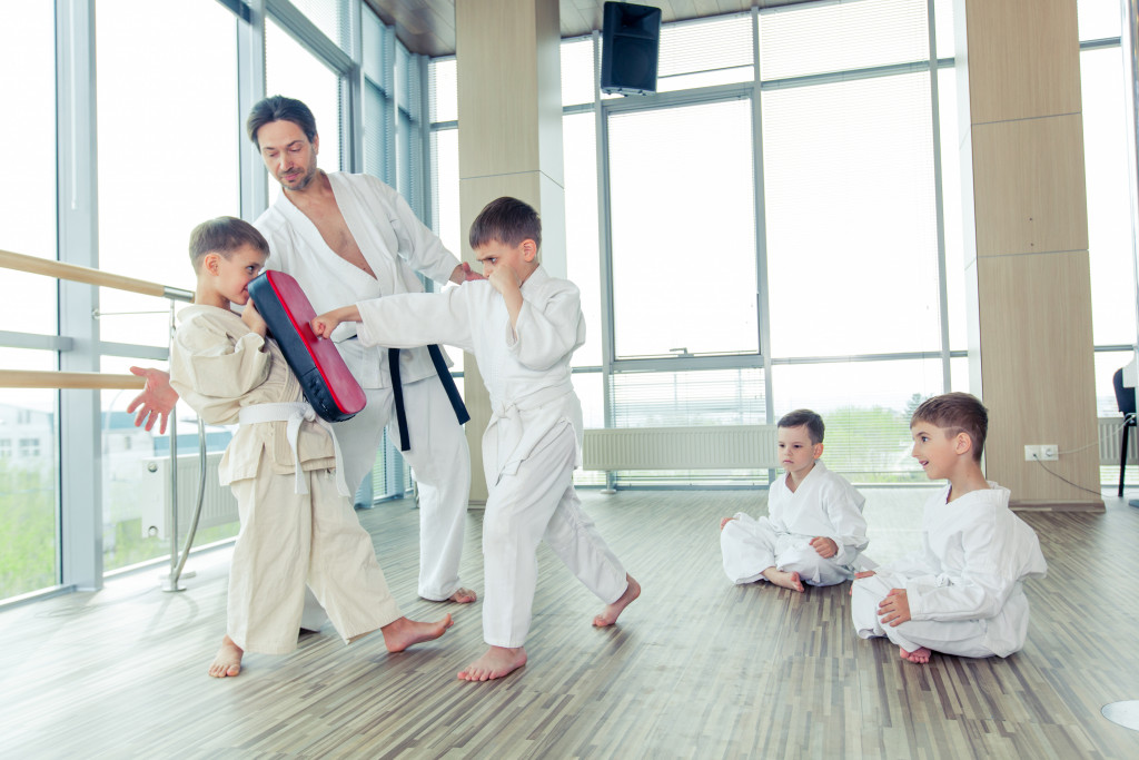 Students learning taekwondo from instructor