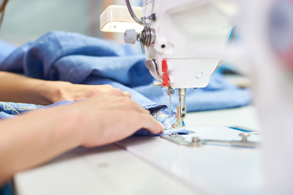 a seamstress sewing fabrics