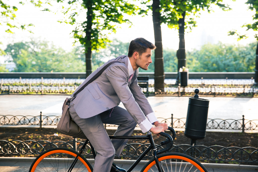 Business executive riding a bicycle to work.