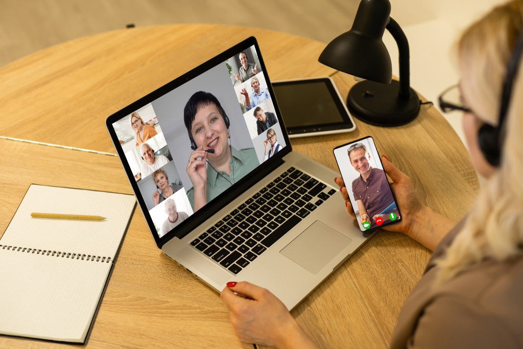 A woman doing a video conference with her team