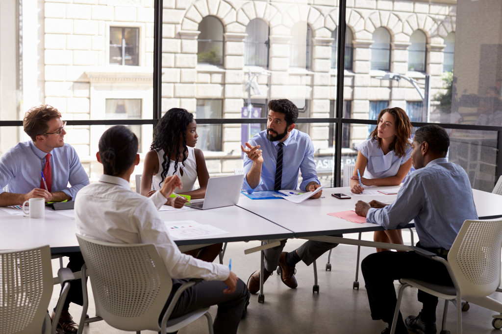 a discussion between a group of pe0ple in the company