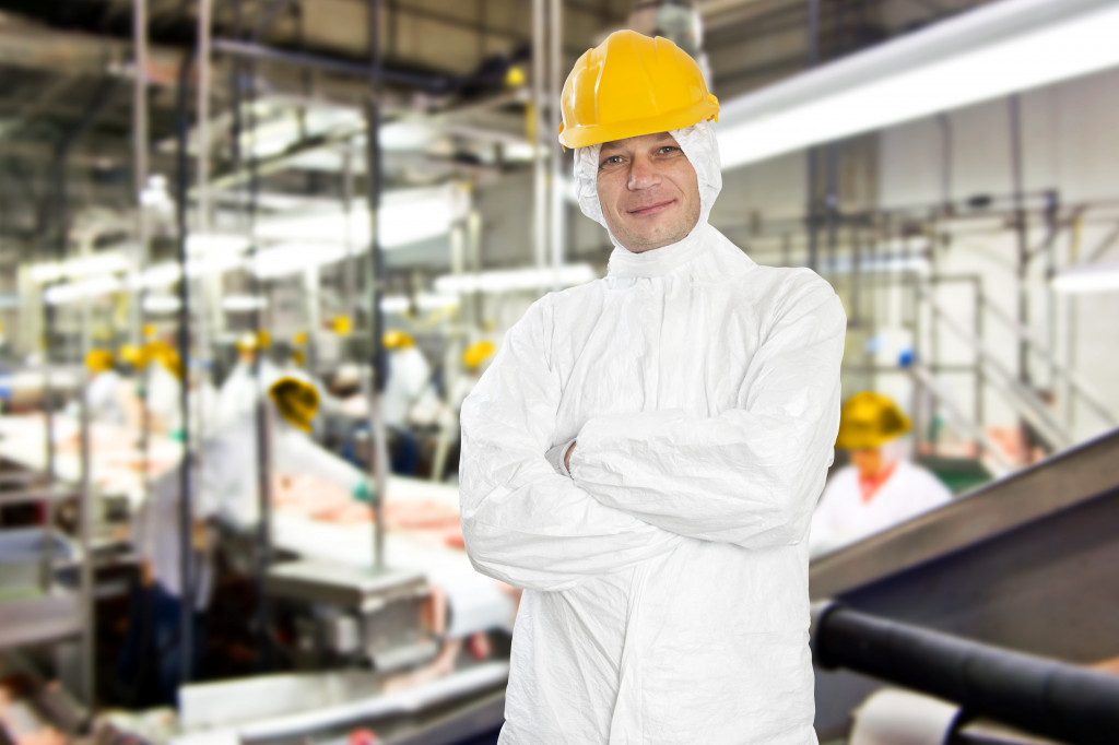 a worker in white uniform smiling