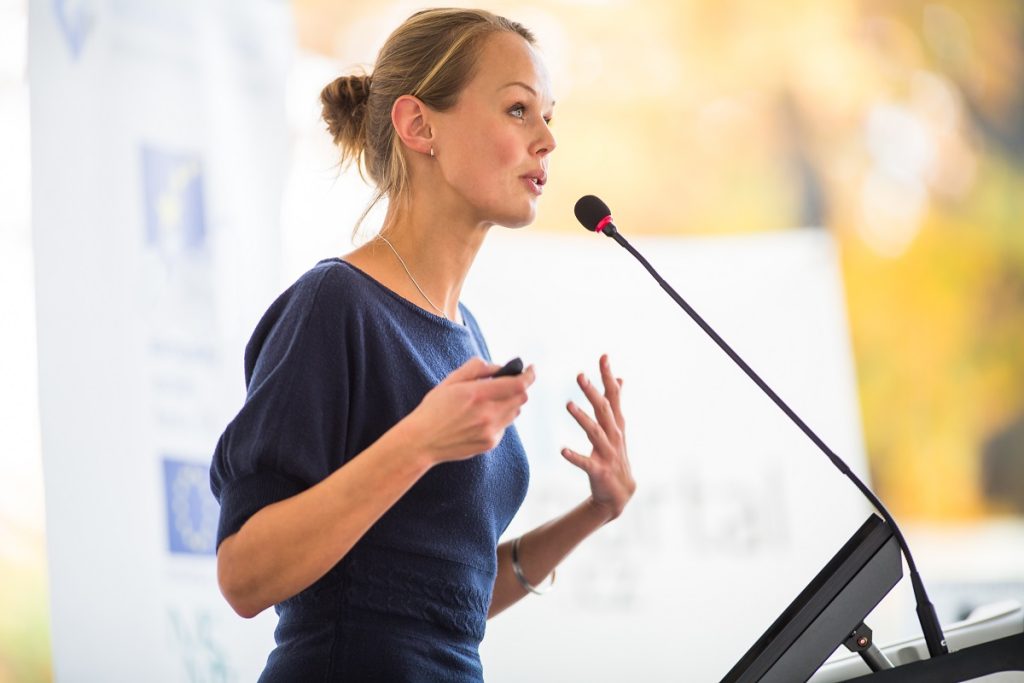 woman giving a presentation in a conference