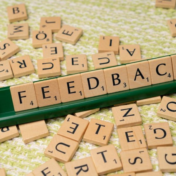 feedback written on small wooden tiles